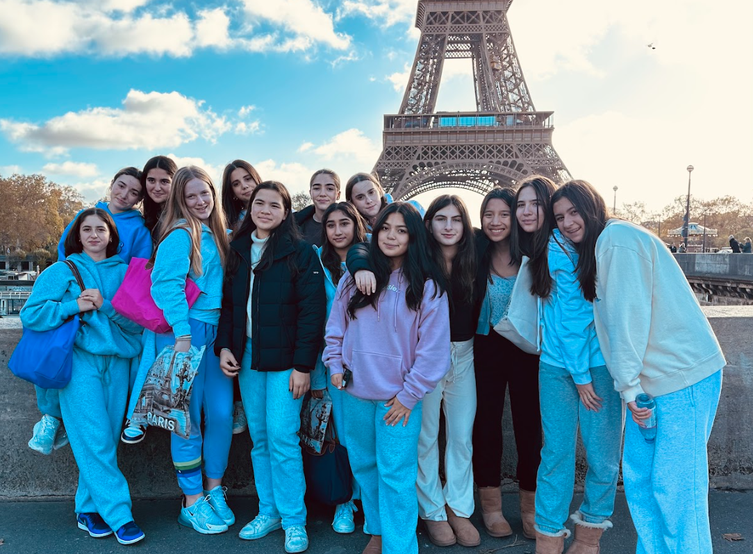 upper school students posing in front of the Colosseum