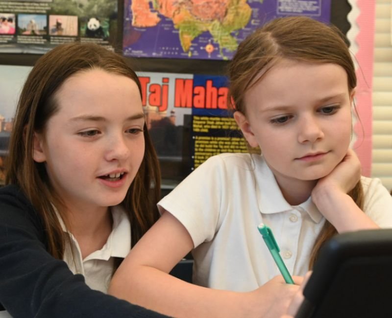 two lower mid students using iPad