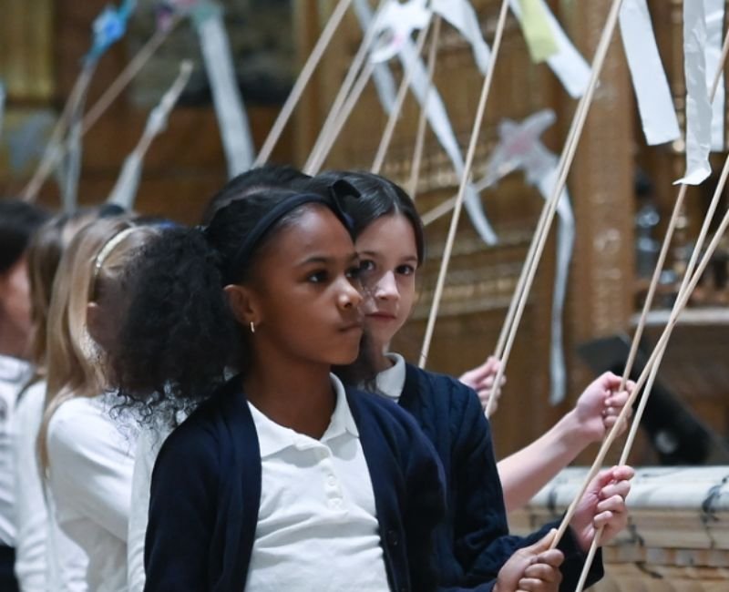 lower mid students performing a religious ceremony