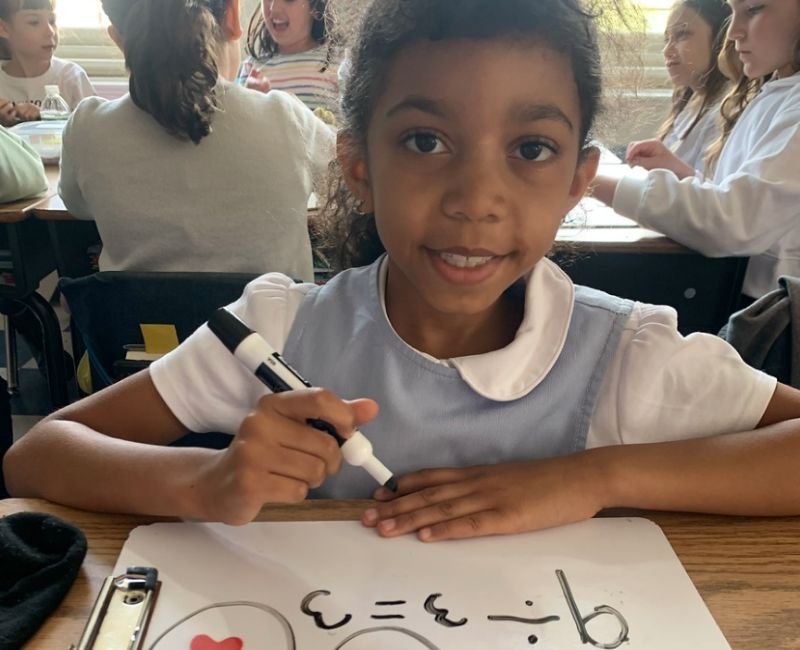 lower school student practicing division