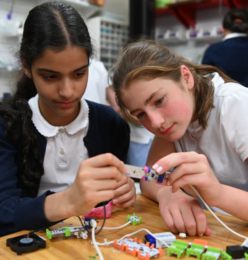 lower middle school students welding electrical components