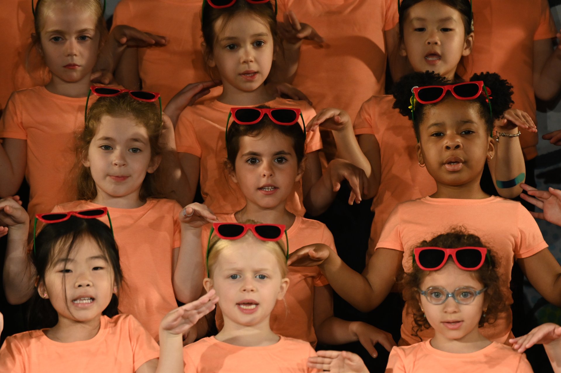 lower school students dressed in orange