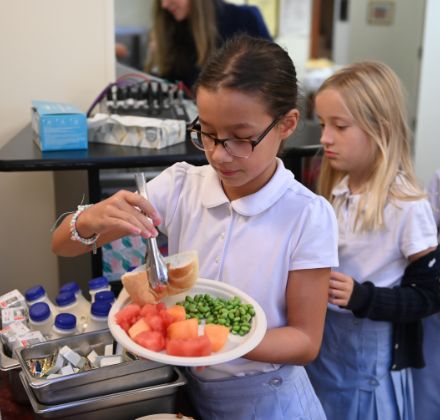 lower school student getting lunch
