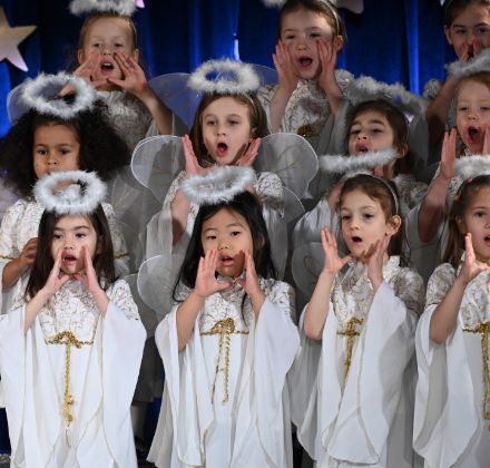 lower school choir students dressed as angels